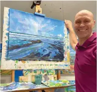  ??  ?? ▲ Mark Warner demonstrat­ing his acrylic seascape to the Sidmouth Society of Artists last month