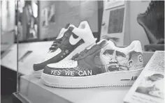  ??  ?? Among thousands of items on display: sneakers with images of President Obama by artist Van Taylor Monroe.