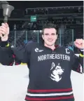  ??  ?? Thrilled: Huskies captain Ryan Shea with the Belpot Trophy