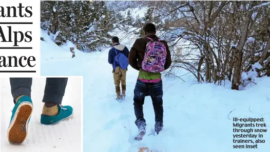  ??  ?? Ill-equipped: Migrants trek through snow yesterday in trainers, also seen inset