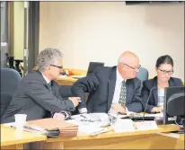  ?? GLEN WHIFFEN/THE TELEGRAM ?? From left, lawyers Terry Rowe and Kevin Stamp confer with Amanda Dean, vice-president Atlantic of the Insurance Bureau of Canada, during a break in hearings at the Public Utilities Board this week.