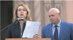  ?? DAVID WALLACE/THE REPUBLIC ?? Former U.S. Rep. Gabrielle Giffords speaks, as her husband, Mark Kelly, looks on, during the dedication for Tucson's January 8th Memorial at El Presidio Park in Tucson on Jan. 8, the seven-year anniversar­y of the mass shooting that left six people dead and 13 others injured, including Giffords.