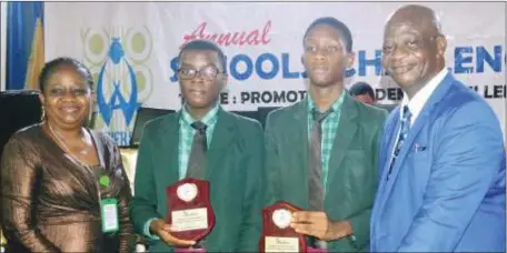  ?? PHOTO:: KOLA ALLI ?? L-R: The Principal, Chrisland Pre-degree College Lekki, Dr. Atinuke Agomoh; winners, Bells Comprehens­ive Secondary School,Ota, Ogun State , Master Kunle Daniel; Master Musa Ziyad; and member Winifred Awosika Foundation, Mr. Segun Ogunsola; during the 10th edition of Winifred Awosika Foundation, annual School Challenge, held in Lagos... recently