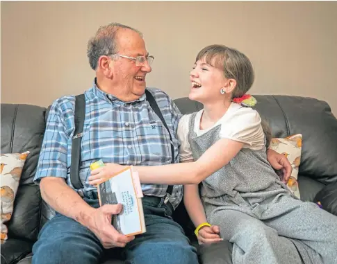  ?? ?? CARING: Sophie Forrest, 11, with her Grandad George, who benefits from the dementia hub. Picture by Kim Cessford.