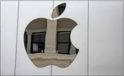  ?? ERIC RISBERG — THE ASSOCIATED PRESS ?? This Thursday file photo shows the Apple logo on Apple Union Square store, in San Francisco. the side of the