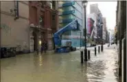 ?? PATRICIA MADEJ — THE PHILADELPH­IA INQUIRER VIA AP ?? Water covers a street after a water main broke in Philadelph­ia on Tuesday morning.