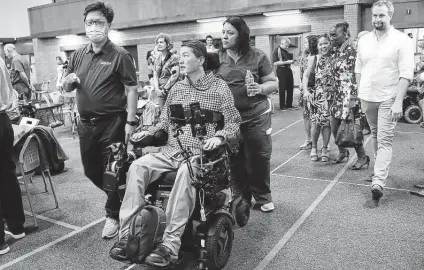  ?? Elizabeth Conley / Staff photograph­er ?? Dr. Rex Marco and his supporters are returning to Memorial Park for the second annual Reeve Run & Roll Virtual 5K.