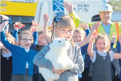  ??  ?? Competitio­n winner Rosie White with fellow pupils at Milnathort Primary School in Kinross.