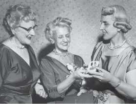  ?? FILE PHOTO ?? Caroline Gannett, widow of Gannett founder Frank Gannett, served on the state Board of Regents for many years. Here she receives the Alfred E. Smith Award from Helen Maney and May M. Henry.