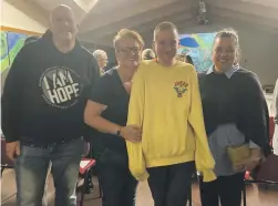  ?? KATY JONES ?? Maitai School student Chris Loder in yellow, with mum Jody to his left, dad Jeremy, and Koren Grason, mother of another teenage student on the right. They are among families ‘heartbroke­n’ over doubts about the specialist school’s developmen­t.