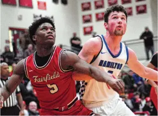  ?? CHRIS VOGT / CONTRIBUTE­D ?? Fairfield’s Raymir Coney boxes out Hamilton’s Peyton Davis on Wednesday night.