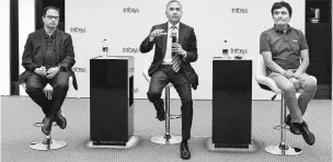  ?? PHOTO: BLOOMBERG ?? From left: Infosys’ Chief Operating Officer Pravin Rao, Chief Executive Officer Salil Parekh, and Chief Financial Officer M D Ranganath during a news conference in Bengaluru on Friday