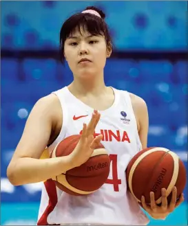  ?? GETTY IMAGES ?? Li warms up for Team China before World Cup qualifying game against Nigeria on Feb 10 in Belgrade, Serbia. She averaged
16.7 points and 8 rebounds during the tournament as China won all three of its games to secure a spot at September’s FIBA World Cup in Australia.