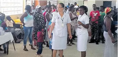  ?? ?? Nurses Sydoney Lawrence (left) and Alicia McFarlene and community members at one of CJC Whitehouse Health Fair, held at the Seaview Community Centre, Whitehouse, Westmorela­nd.