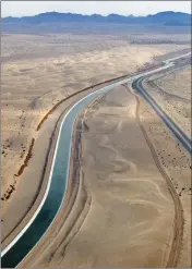  ?? FILE PHOTO BY RANDY HOEFT/YUMA SUN ?? WATER FLOWS THROUGH the All American Canal as it snakes its way through the Imperial Sand Dunes.