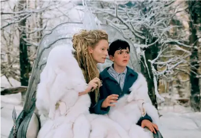  ??  ?? Left: Swinton attends the The Souvenir press conference during the 69th Berlin Internatio­nal Film Festival in 2019. Above: Playing the White Witch in The Lion, the Witch and the Wardrobe.