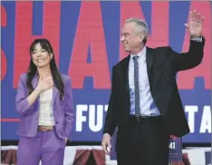  ?? ERIC RISBERG AP PHOTO/ ?? Presidenti­al candidate Robert F. Kennedy Jr. (right) waves on stage with Nicole Shanahan, after announcing her as his running mate, during a campaign event, on Tuesday in Oakland, Calif.