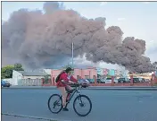  ?? AFP ?? A cloud of smoke from a fire in the background after a missile strike on a warehouse in Odesa on Saturday.