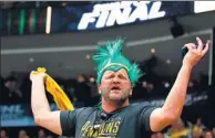  ?? KIRK IRWIN / GETTY IMAGES / AFP ?? A Pittsburgh Penguins fan cheers on his team against the Nashville Predators in Game 1 of the NHL Stanley Cup final at PPG Paints Arena on Monday in Pittsburgh, Pennsylvan­ia.