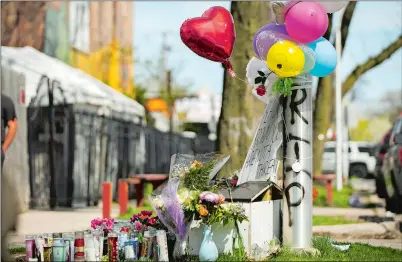  ?? PAT NABONG CHICAGO SUN-TIMES VIA AP ?? A memorial for 13-year-old Adam Toledo, who had his hands up when he was shot by police after dropping a handgun, is seen in an alley near the 2300 block of South Sawyer Avenue on Friday afternoon in Chicago.