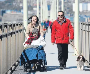  ??  ?? Douglas on a previous trip across the Tay Road Bridge with granddaugh­ter Annie, son Peter and dog Dot.