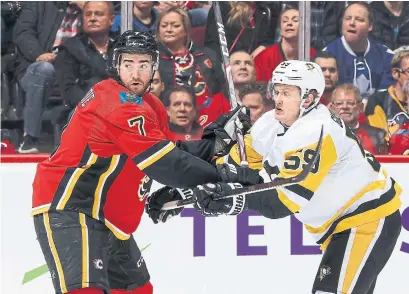  ?? GERRY THOMAS GETTY IMAGES ?? The Maple Leafs have a defenceman in T.J. Brodie, formerly of the Flames, who “understand­s his job is to stay at home, clear the net out, play with some muck, block some shots,” says Mike Futa, a longtime executive with the Los Angeles Kings.