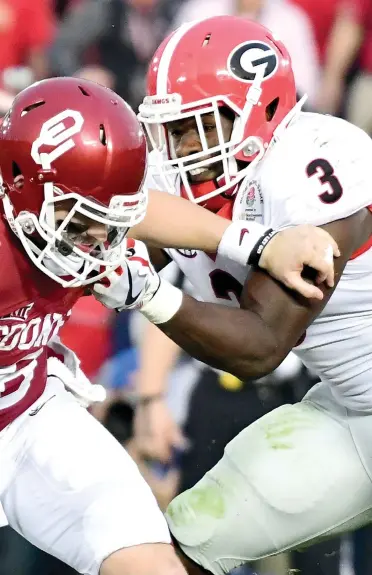  ?? HARRY HOW/GETTY IMAGES ?? Roquan Smith, taking down Oklahoma quarterbac­k Baker Mayfield in the 2018 College Football Playoff semifinal, rose to dominance at Georgia.