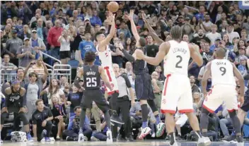  ?? — USA Today Sports ?? Toronto Raptors’ guard Danny Green (14) shoots the game-winning basket against Orlando Magic forward Aaron Gordon (00) during the fourth quarter at Amway Center.