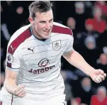  ??  ?? CLARET AND BRUISER Chris Wood hurts Bournemout­h with Burnley’s first goal