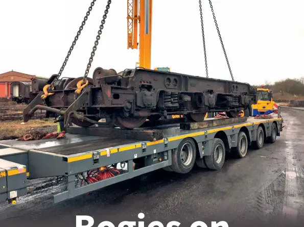  ?? (All photos IDRS) ?? MAIN PICTURE:
The first bogie is lowered onto the flatbed trailer at Swanwick on February 19.