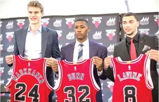  ?? JAMES FOSTER/ FOR THE SUN- TIMES ?? The organizati­on’s emphasis will be the developmen­t of young stars Lauri Markkanen, Kris Dunn and Zach LaVine. All three showed flashes during the 2017- 18 season.