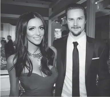  ?? ASHLEY FRASER / POSTMEDIA NEWS ?? Melinda Karlsson, with husband, Ottawa Senators captain Erik Karlsson, alleges that the fiancée of Senators forward Mike Hoffman harassed her online as she dealt with the still birth of her son last March.