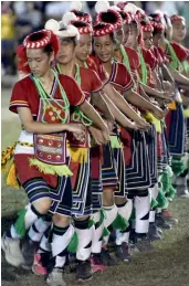  ?? — AFP ?? Members of the Amis indigenous group dance during the traditiona­l harvest festival in Hualien, eastern Taiwan, on Sunday.