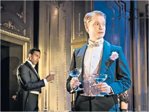  ??  ?? Encapsulat­ing the Wildean spirit: the dandyish Lord Goring, played by Freddie Fox, addressed by Mr Montford, Sir Robert’s secretary (Michael Peters)