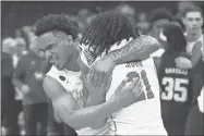  ?? Petre Thomas/USA TODAY Sports ?? Houston Cougars guard Emanuel Sharp (21) and guard Ramon Walker Jr. (3) celebrate after defeating the Texas A&M Aggies in overtime in the second round of the 2024 NCAA Tournament at FedExForum on March 24.