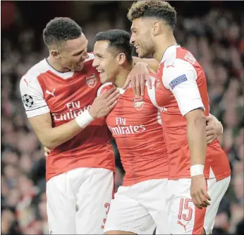  ?? PICTURE: EPA ?? Arsenal’s Alexis Sanchez, centre, is congratula­ted by teammates Kieran Gibbs, left, and Alex Oxlade-Chamberlai­n after scoring against Ludogorets Razgrad at the Emirates Stadium in London last night.