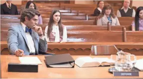  ?? BRIAN DOUGLAS ?? Ted Bundy (Zac Efron) gets support in court from girlfriend Liz (Lily Collins) in the Netflix drama “Extremely Wicked, Shockingly Evil, and Vile.”