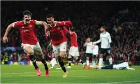  ?? Martin Rickett/PA ?? Cristiano Ronaldo (second left) celebrated scoring Manchester United’s winner against Atalanta with Harry Maguire, who had levelled the scores six minutes earlier. Photograph: