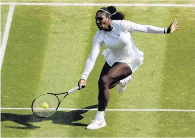  ?? BEN CURTIS/AFP/GETTY IMAGES ?? Serena Williams makes a forehand return against Germany’s Julia Goerges during their women’s singles semifinal Thursday. Williams won 6-2, 6-4 to advance to her 10th Wimbledon singles final.