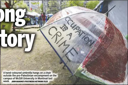  ?? JOHN MAHONEY/POSTMEDIA NETWORK FILES ?? A hand-coloured umbrella hangs on a chair outside the pro-palestinia­n encampment on the campus of Mcgill University in Montreal last week.
