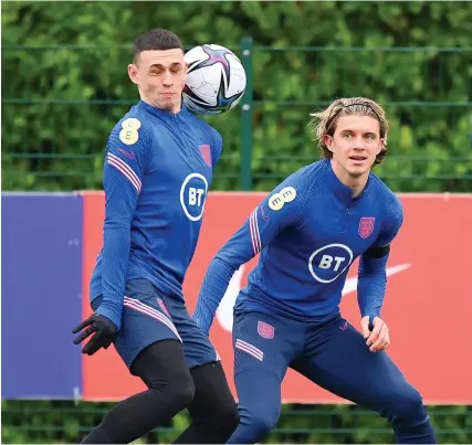  ?? Picture; Justin Setterfiel­d/Getty ?? Conor Gallagher, right, and Phil Foden at an England training session yesterday