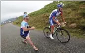  ?? THIBAULT CAMUS — THE ASSOCIATED PRESS ?? A spectator cheers on French rider Thibaut Pinot during the 15th stage of the Tour de France on Sunday.