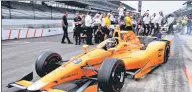  ?? USA TODAY SPORTS ?? Fernando Alonso drives out of the pits during his qualifying run for this weekend’s Indianapol­is 500.