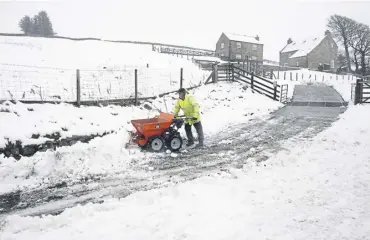  ?? ?? Heavy snow in Allenheads, Northumber­land. More snow and ice is forecast for Scotland today