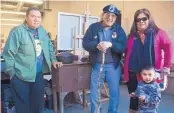 ?? MARLA BROSE/JOURNAL ?? From left, Monty Singer, Bobby Valdez, a woman who goes by Bluebird, and her son, Bear, all members of the American Indian Movement, stand by the metal stove they will take to the DAPL protest camp.