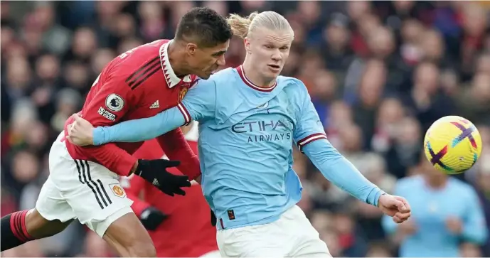  ?? ?? Manchester United Raphael Varane puts pressure on Manchester City’s striker, Erling Haaland when both sides last met in the Premier League at Ol Trafford