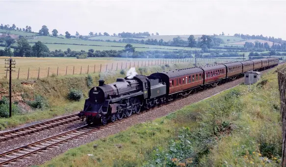  ?? R C Riley ?? BR Standard ‘4MT’ No 75027 passes Shepton Montague with 1E58, the 11.12am from Bournemout­h (West) to Sheffield (Midland) on 1 September 1962. The train is likely to pick up a pilot at the Evercreech Junction water stop for the steep climb, mostly at 1 in 50, to the summit at Masbury. This is another returning train of an overnight service, in this case the balancing working of 1O82, the 10.20pm from Sheffield (Midland) to Bournemout­h (West). These versatile engines were introduced to the S&D in 1956 and soon found a home on passenger trains and as an ideal substitute for the LMS ‘2P’ 4-4-0s on pilot duties.