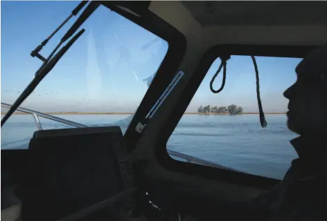  ?? Leah Millis / The Chronicle 2015 ?? John Sweeney, owner of Point Buckler in Suisun Bay, faces fines and an order to restore landfill that he discharged into marsh waters.