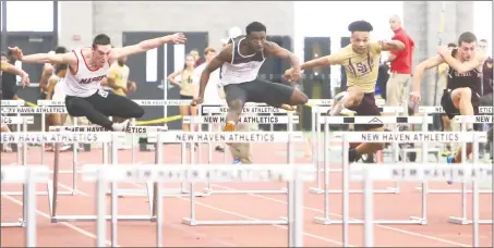  ?? Emily J. Reynolds / For Hearst Connecticu­t Media ?? Hillhouse’s Deshaune Poole leads the pack en route to a win in the 55 meter hurdles in the Class M indoor track and field championsh­ip Saturday in New Haven. Masuk’s Aidan McShane, left of Poole, finished second.