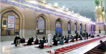  ?? AP PHOTO/KHALID MOHAMMED ?? In this Saturday, file photo, Muslims perform evening prayer at the Sunni shrine of Abdul-Qadir al-Gailani, ahead of the upcoming Muslim fasting month of Ramadan, in Baghdad, Iraq. Muslims are facing their second Ramadan in the shadow of the pandemic. Many Muslim majority countries have been hit by an intense new coronaviru­s wave. While some countries imposed new Ramadan restrictio­ns, concern is high that the month’s rituals could stoke a further surge.